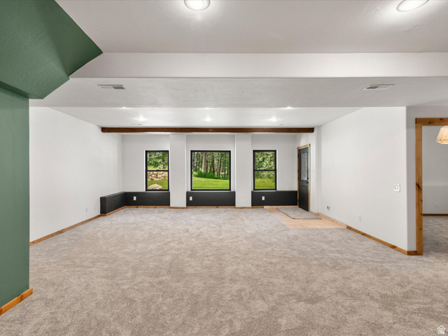 1225 Old Oregon Road Soda Springs, ID 83276 - Photo 29 of 67 Spacious interior room featuring light-toned carpeting, white walls, and a recessed ceiling with integrated lighting