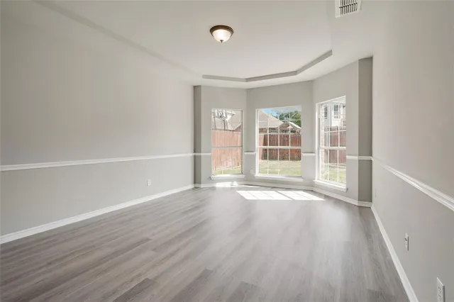 a bath tub sitting next to a shower