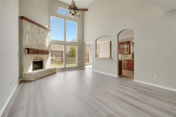 a large kitchen with stainless steel appliances sink a microwave and cabinets