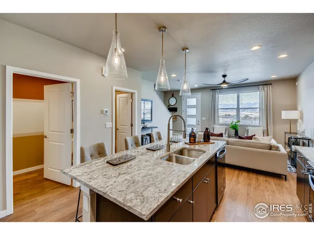 a kitchen with granite countertop counter space a sink appliances and cabinets