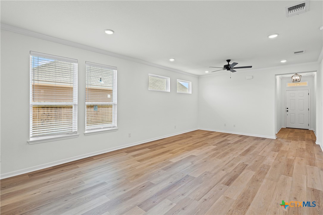 7810 Timber Holw Lane Temple, TX 76502 - Photo 12 of 32 a view of empty room with wooden floor and fan