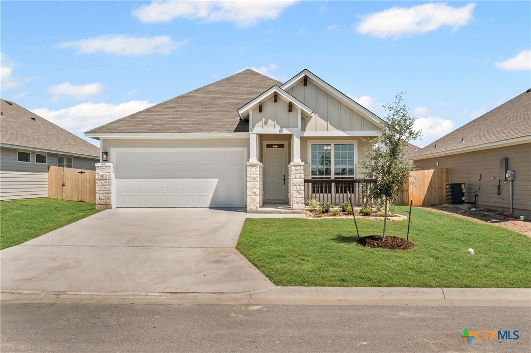 7810 Timber Holw Lane Temple, TX 76502 - Photo 2 of 32 a front view of house with a garden and patio