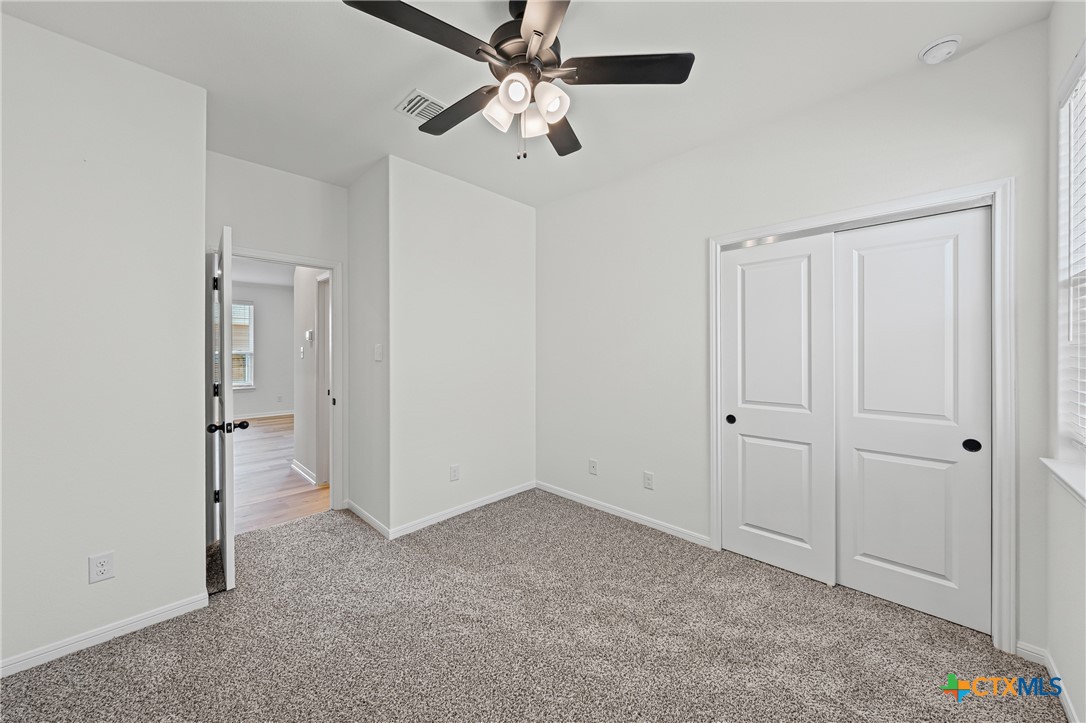 7810 Timber Holw Lane Temple, TX 76502 - Photo 23 of 32 a view of an empty room and chandelier fan