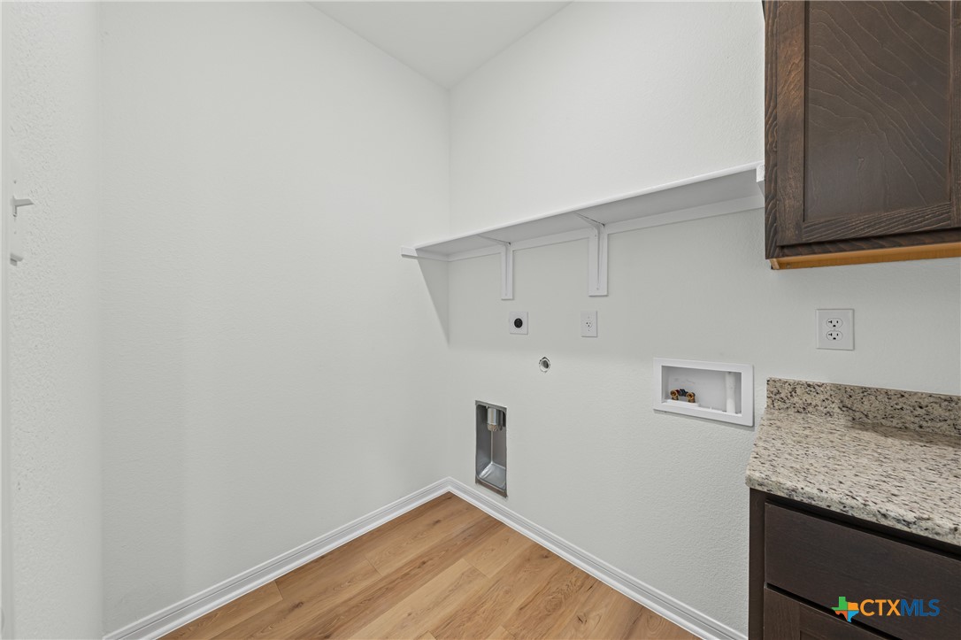 7810 Timber Holw Lane Temple, TX 76502 - Photo 30 of 32 a view of storage and utility room with wooden floor