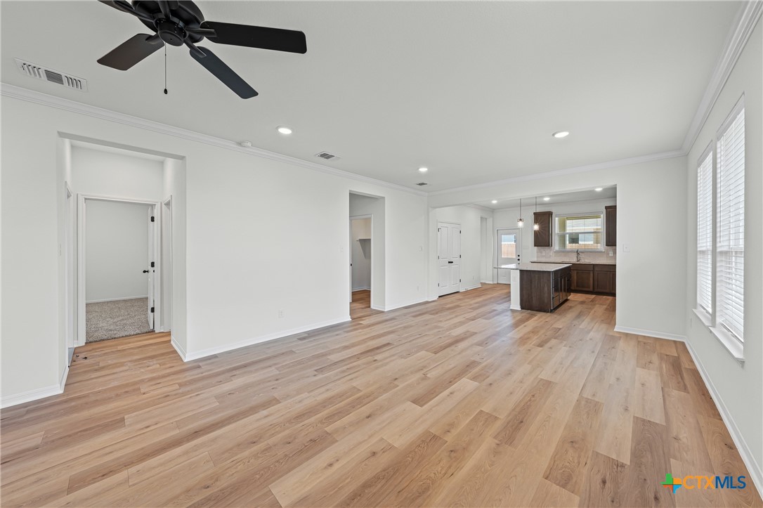 7810 Timber Holw Lane Temple, TX 76502 - Photo 10 of 32 a view of empty room with wooden floor and ceiling fan
