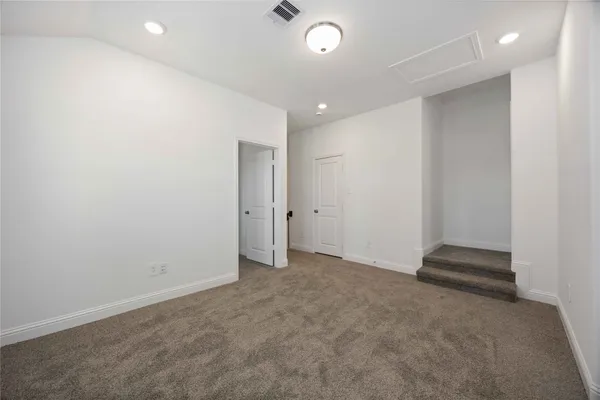 an empty room with staircase