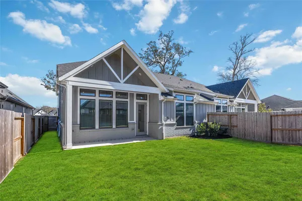 a front view of a house with a yard and porch