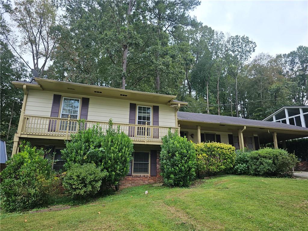 3144 Flamingo Drive East Point, GA 30344 - Photo 1 of 1 a front view of a house with a yard