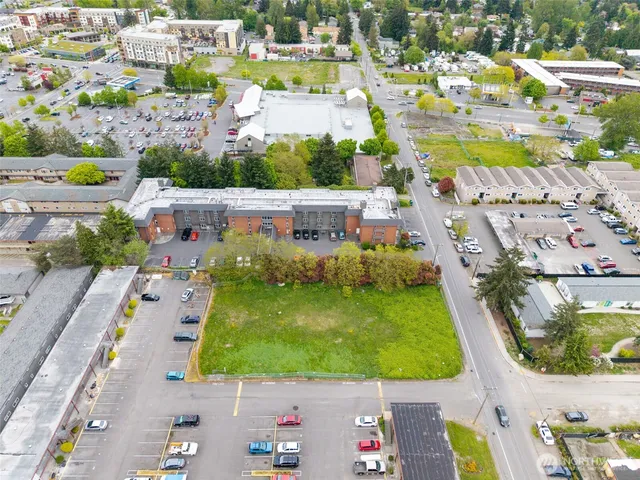 a view of swimming pool with a table and chairs in patio
