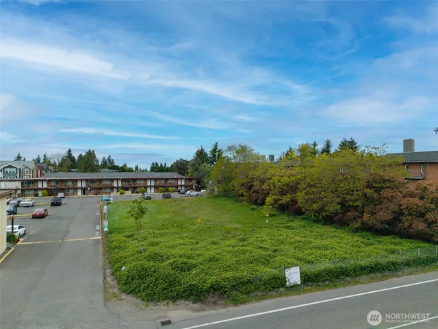 a view of a swimming pool with outdoor seating