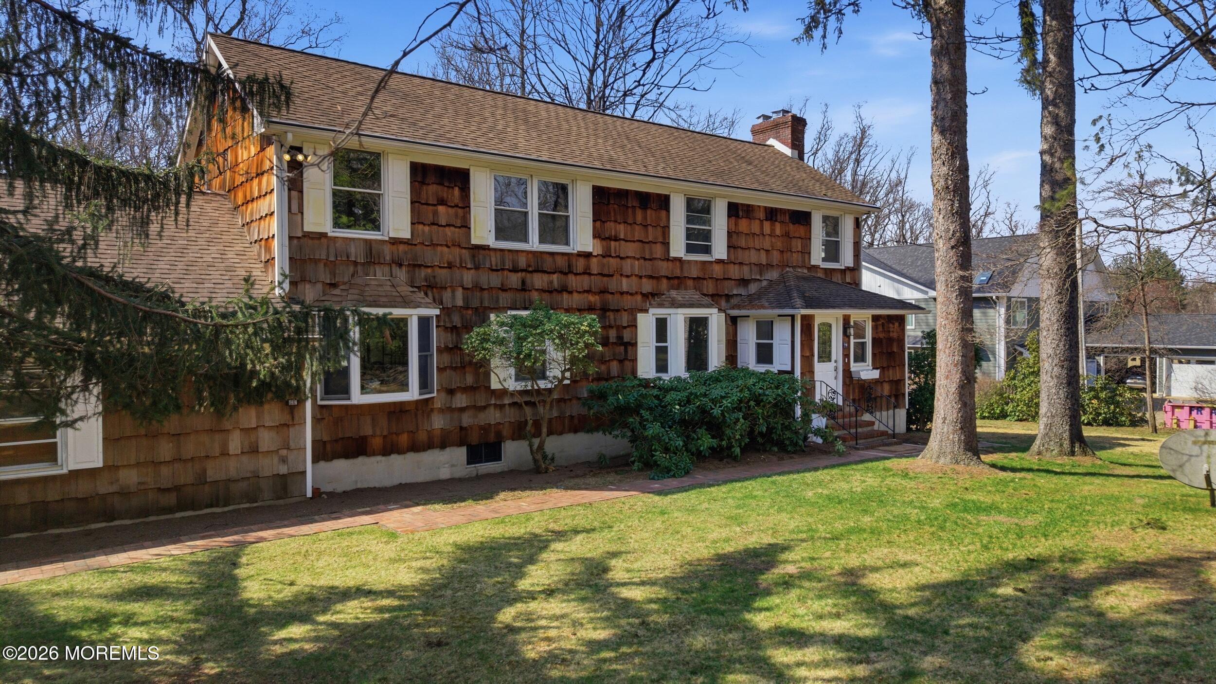 76 Telegraph Hill Road Holmdel, NJ 07733 - Photo 1 of 51 a front view of a house with garden