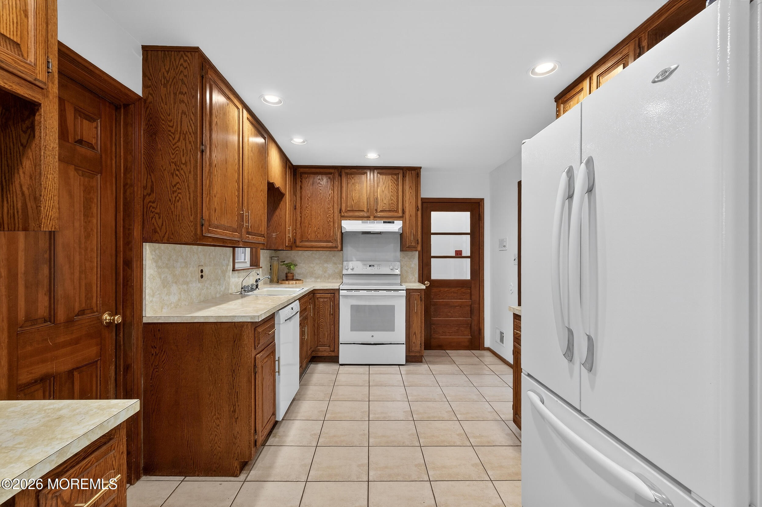 76 Telegraph Hill Road Holmdel, NJ 07733 - Photo 11 of 51 a kitchen with stainless steel appliances a refrigerator sink and cabinets