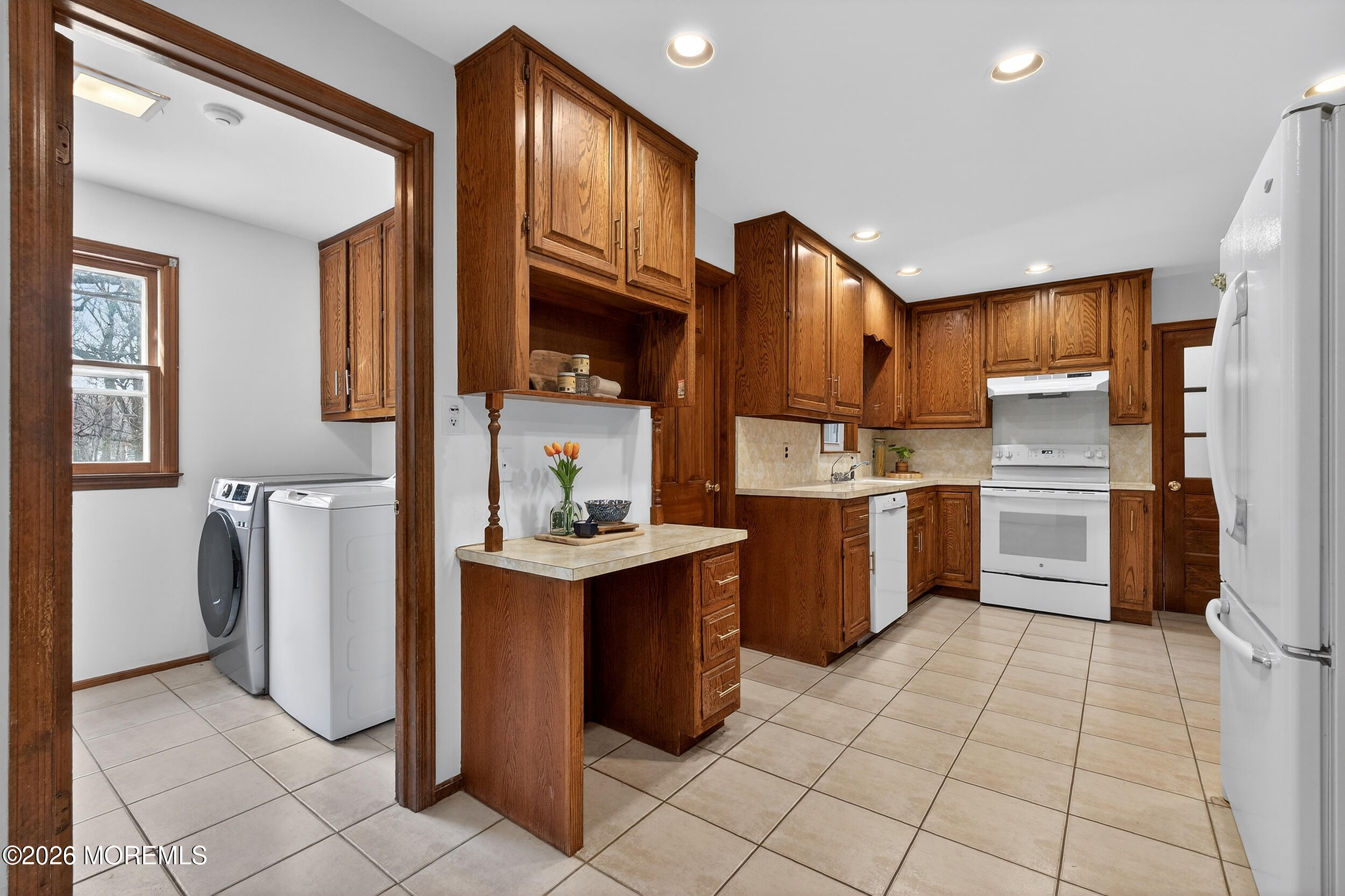 76 Telegraph Hill Road Holmdel, NJ 07733 - Photo 12 of 51 a kitchen with a sink refrigerator and cabinets