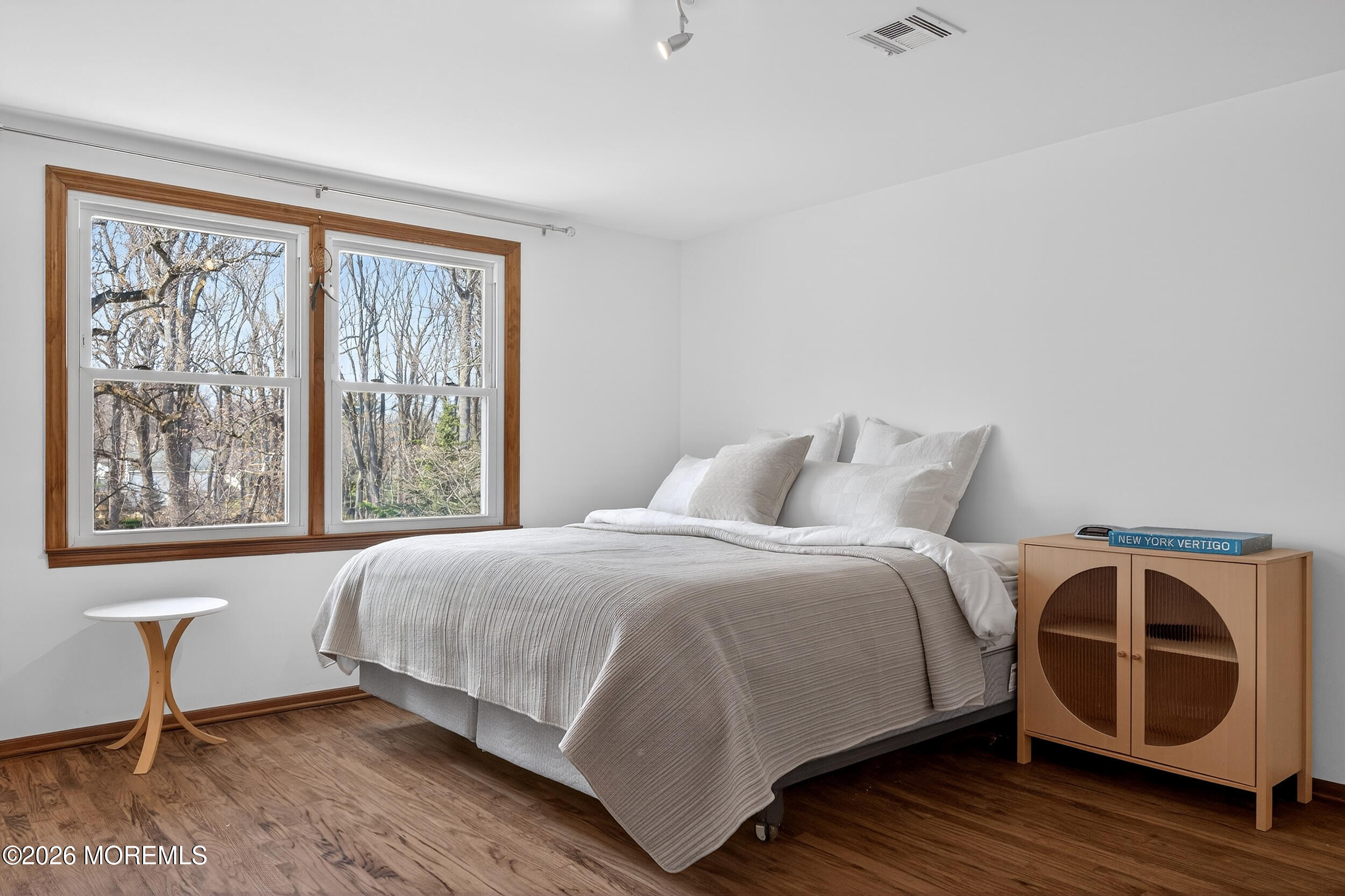 76 Telegraph Hill Road Holmdel, NJ 07733 - Photo 27 of 51 a bedroom with a bed and wooden floor