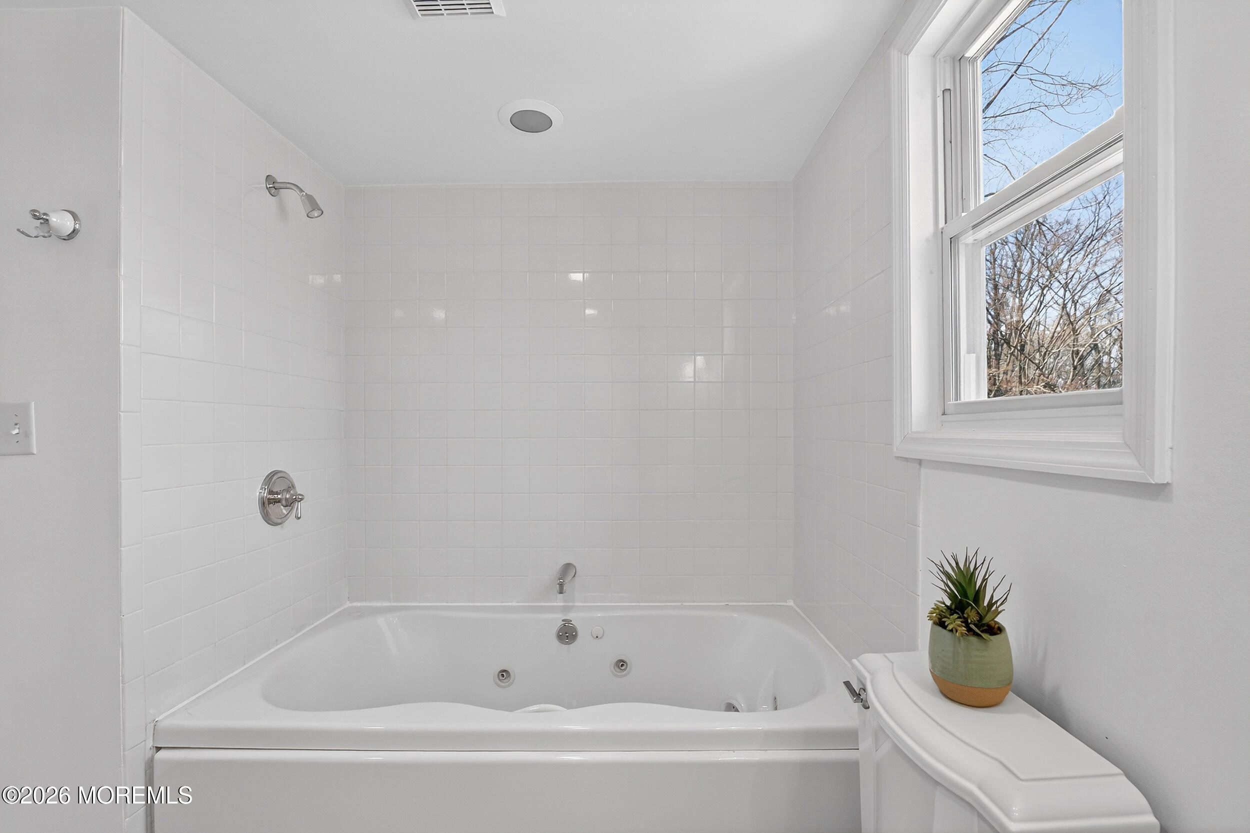 76 Telegraph Hill Road Holmdel, NJ 07733 - Photo 31 of 51 a white bath tub with a shower