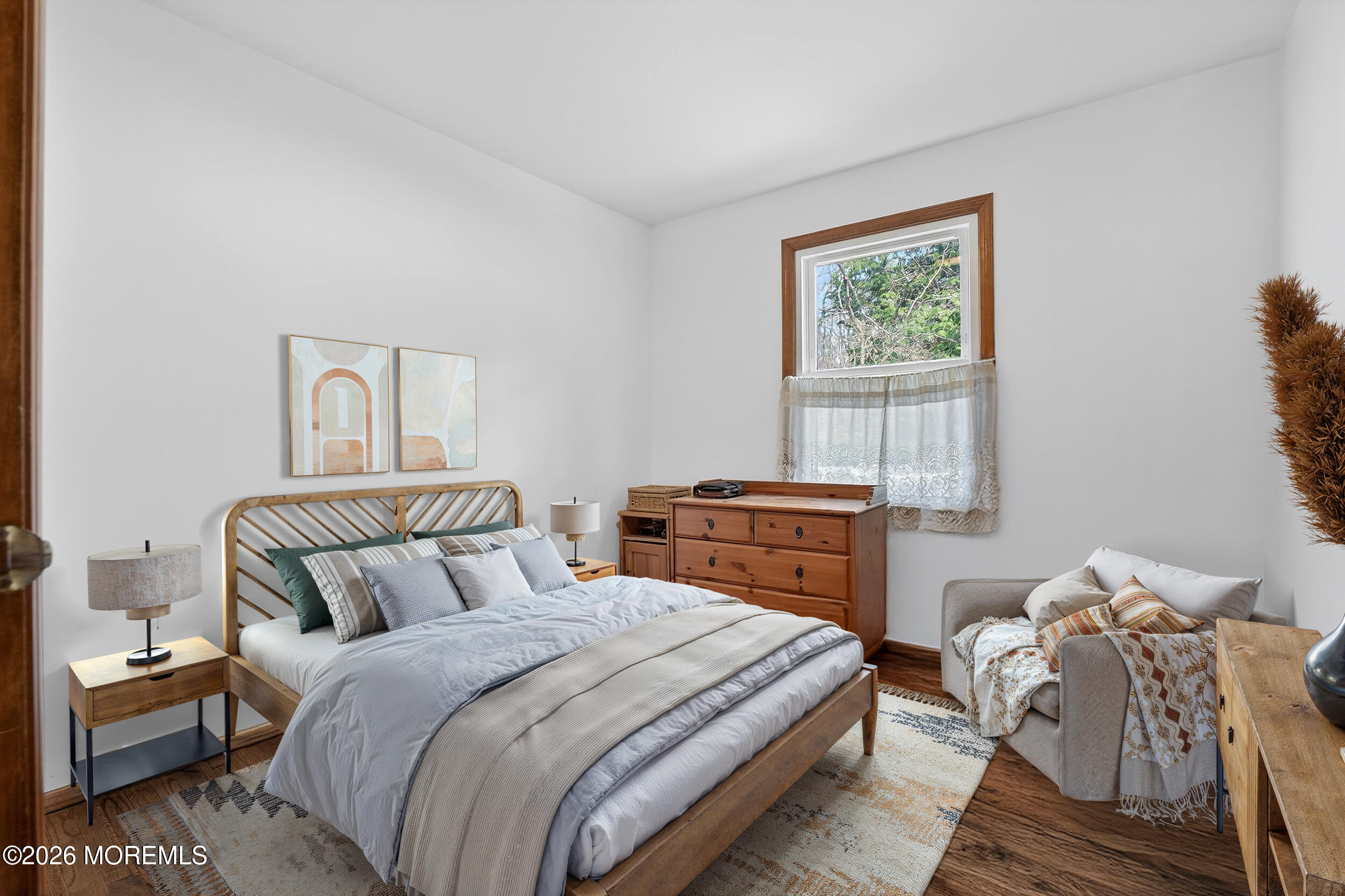76 Telegraph Hill Road Holmdel, NJ 07733 - Photo 33 of 51 a bedroom with a bed and wooden floor