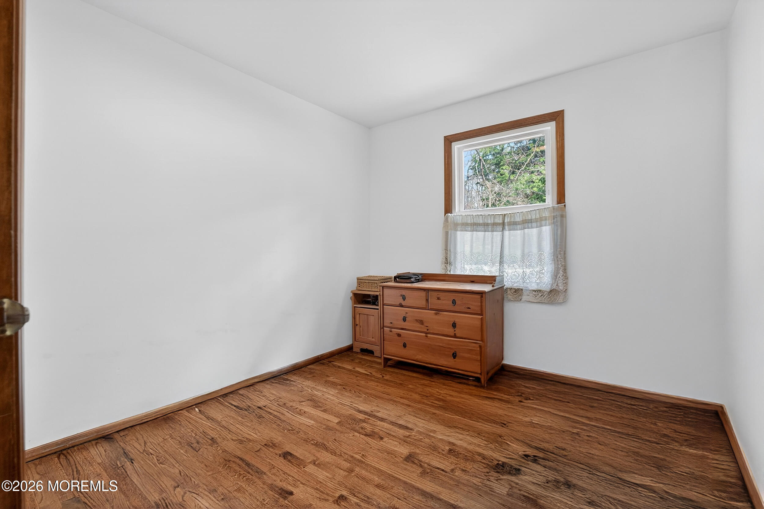 76 Telegraph Hill Road Holmdel, NJ 07733 - Photo 34 of 51 an empty room with wooden floor and window
