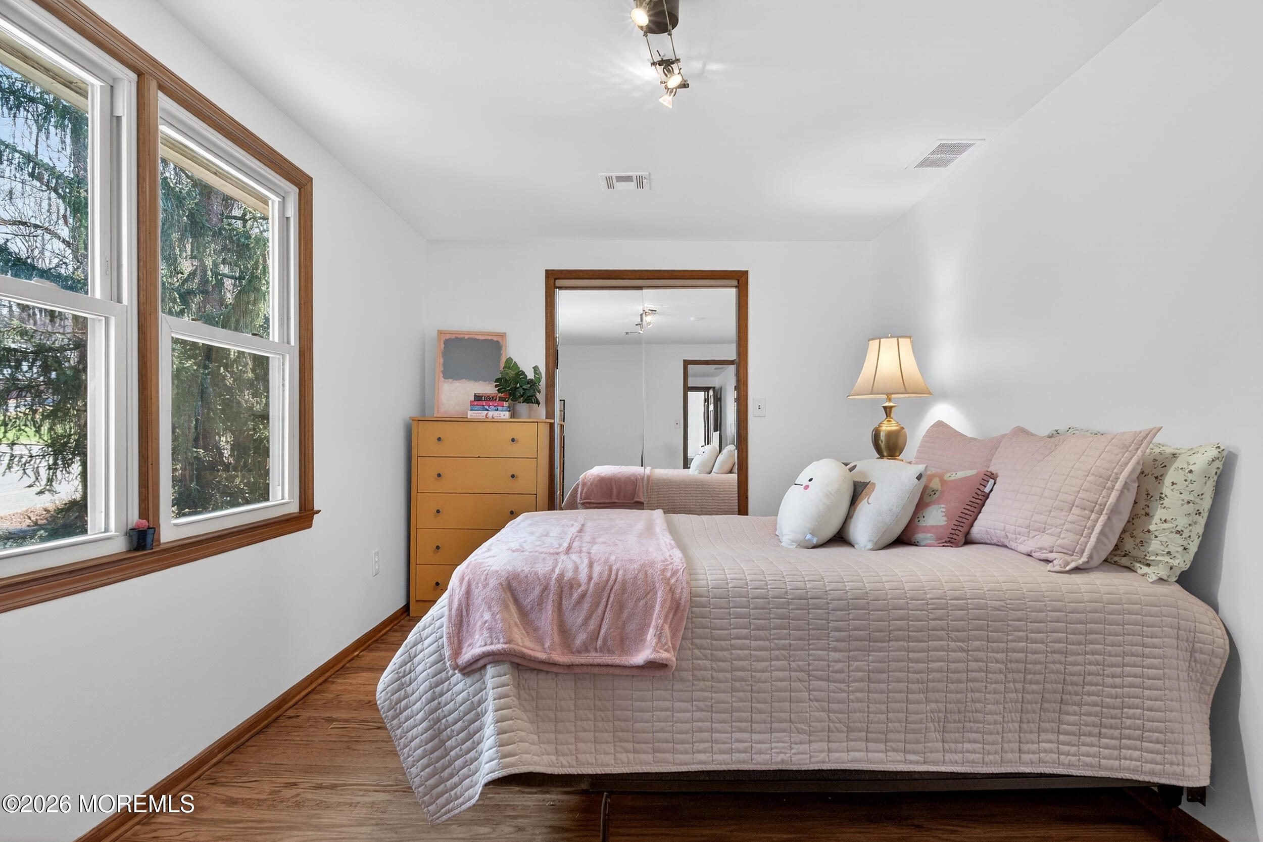 76 Telegraph Hill Road Holmdel, NJ 07733 - Photo 38 of 51 a bedroom with a bed and wooden floor