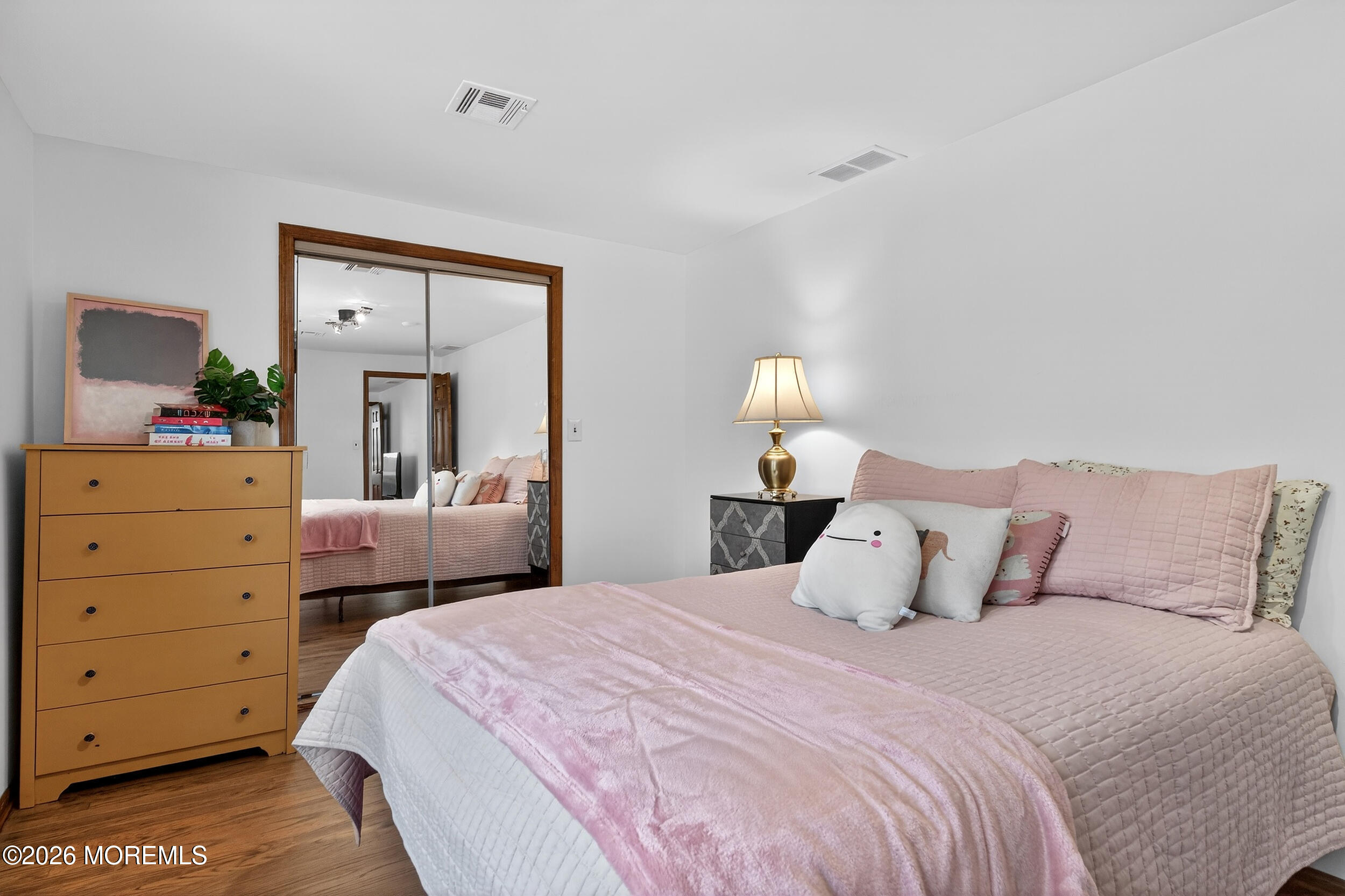 76 Telegraph Hill Road Holmdel, NJ 07733 - Photo 39 of 51 a bedroom with a bed and a night stand
