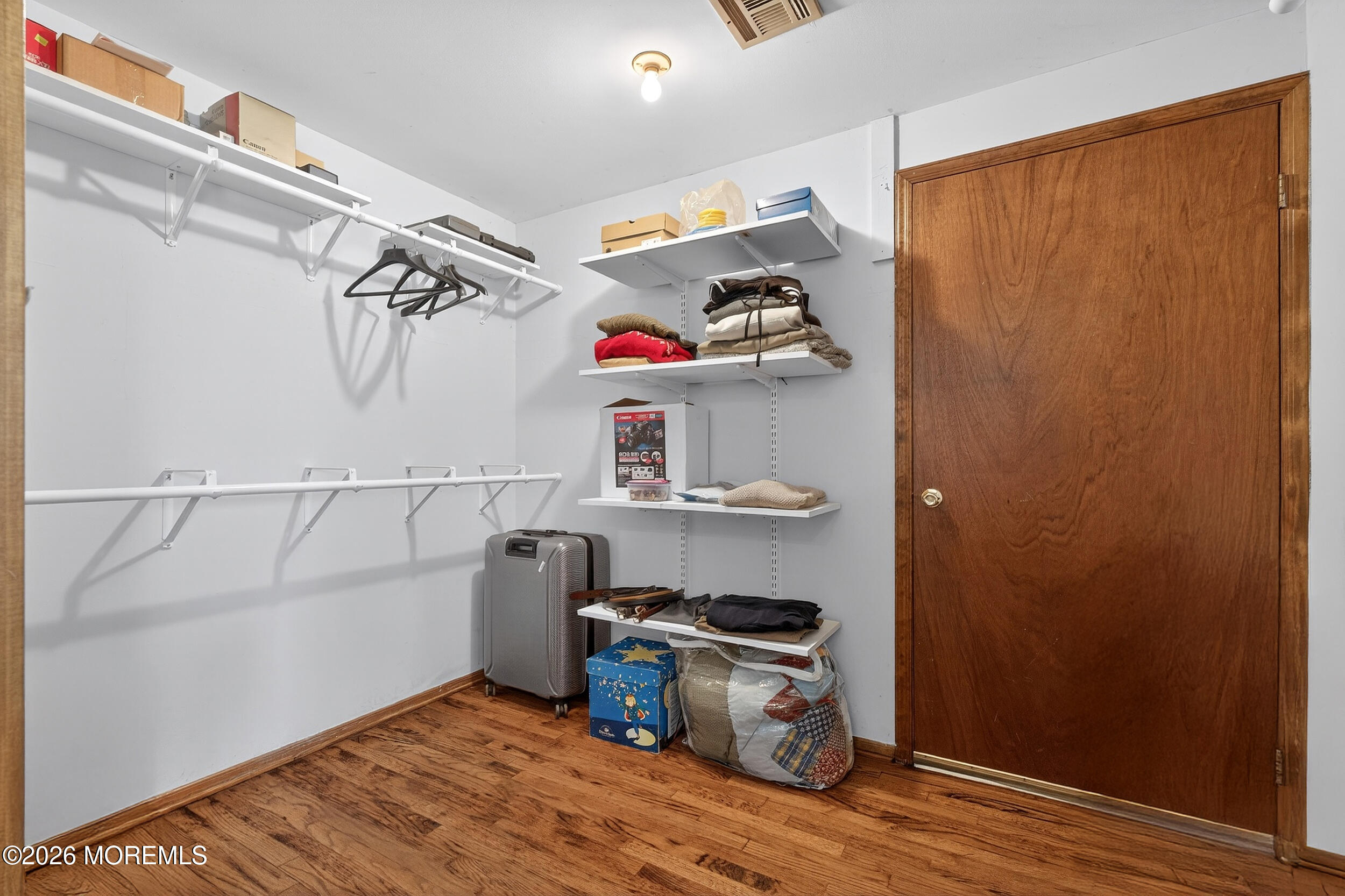 76 Telegraph Hill Road Holmdel, NJ 07733 - Photo 40 of 51 a view of walk in closet with clothes and shoes