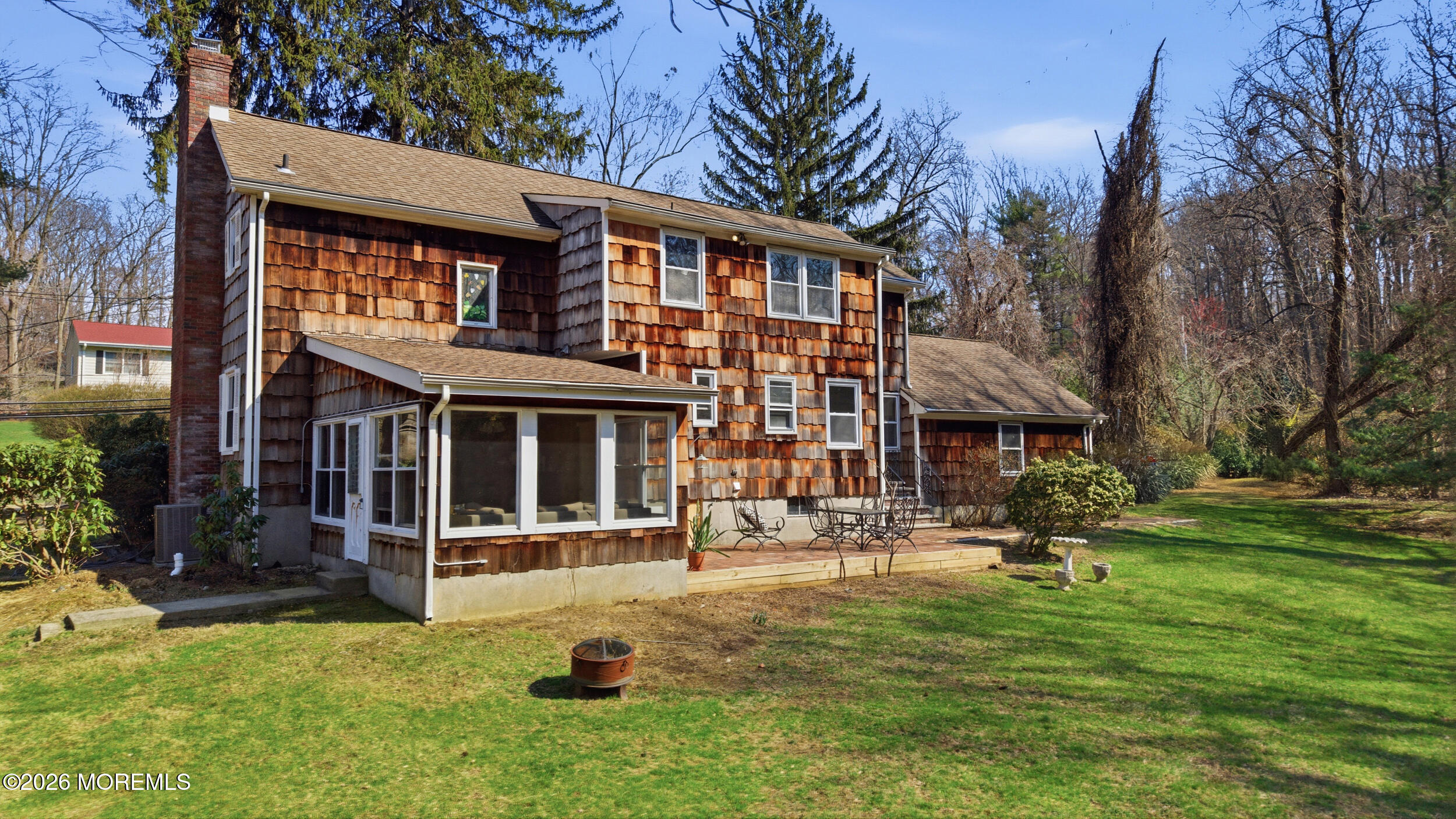 76 Telegraph Hill Road Holmdel, NJ 07733 - Photo 42 of 51 a front view of a building with a garden