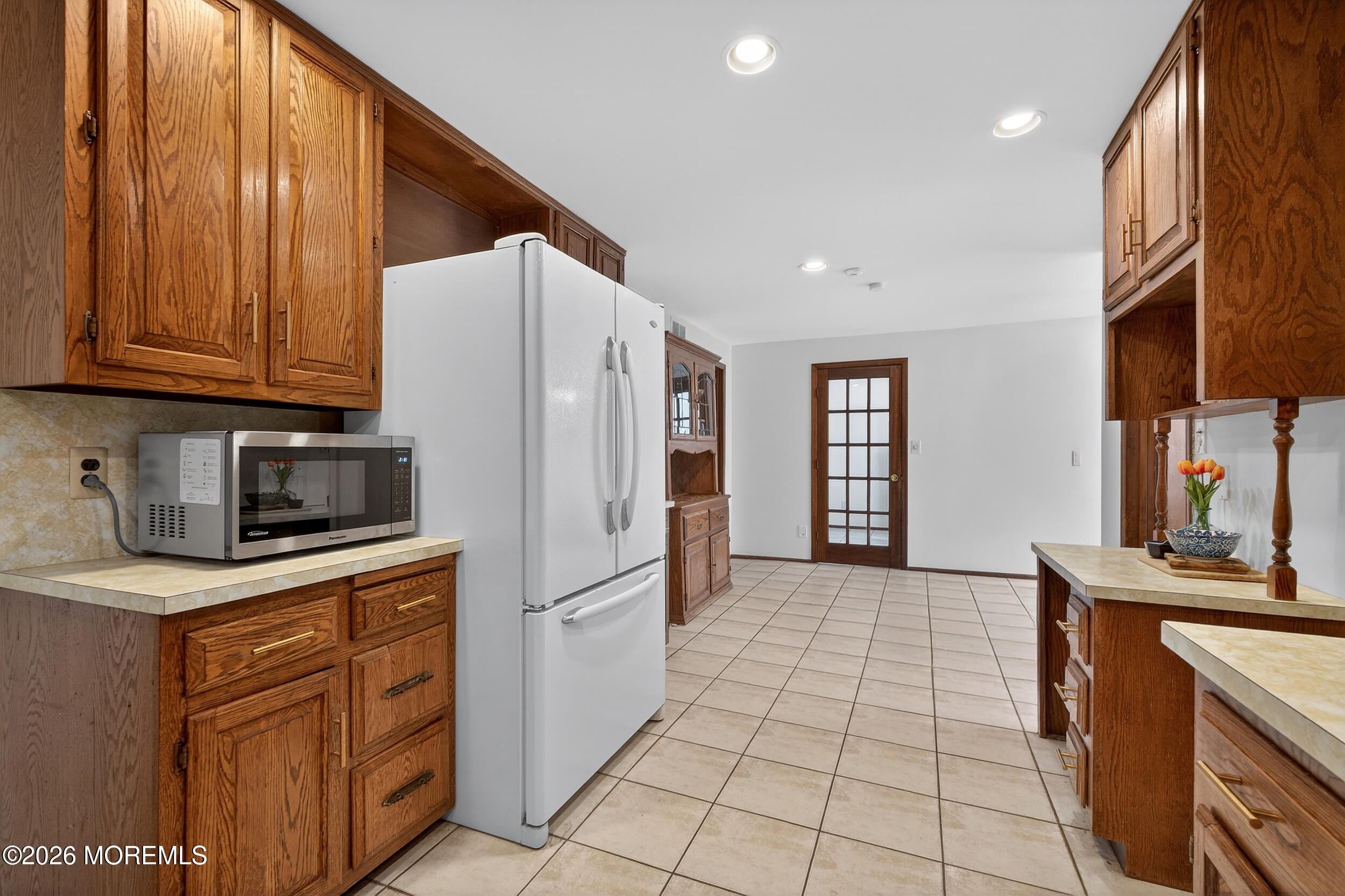 76 Telegraph Hill Road Holmdel, NJ 07733 - Photo 9 of 51 a kitchen with stainless steel appliances granite countertop a refrigerator sink and cabinets