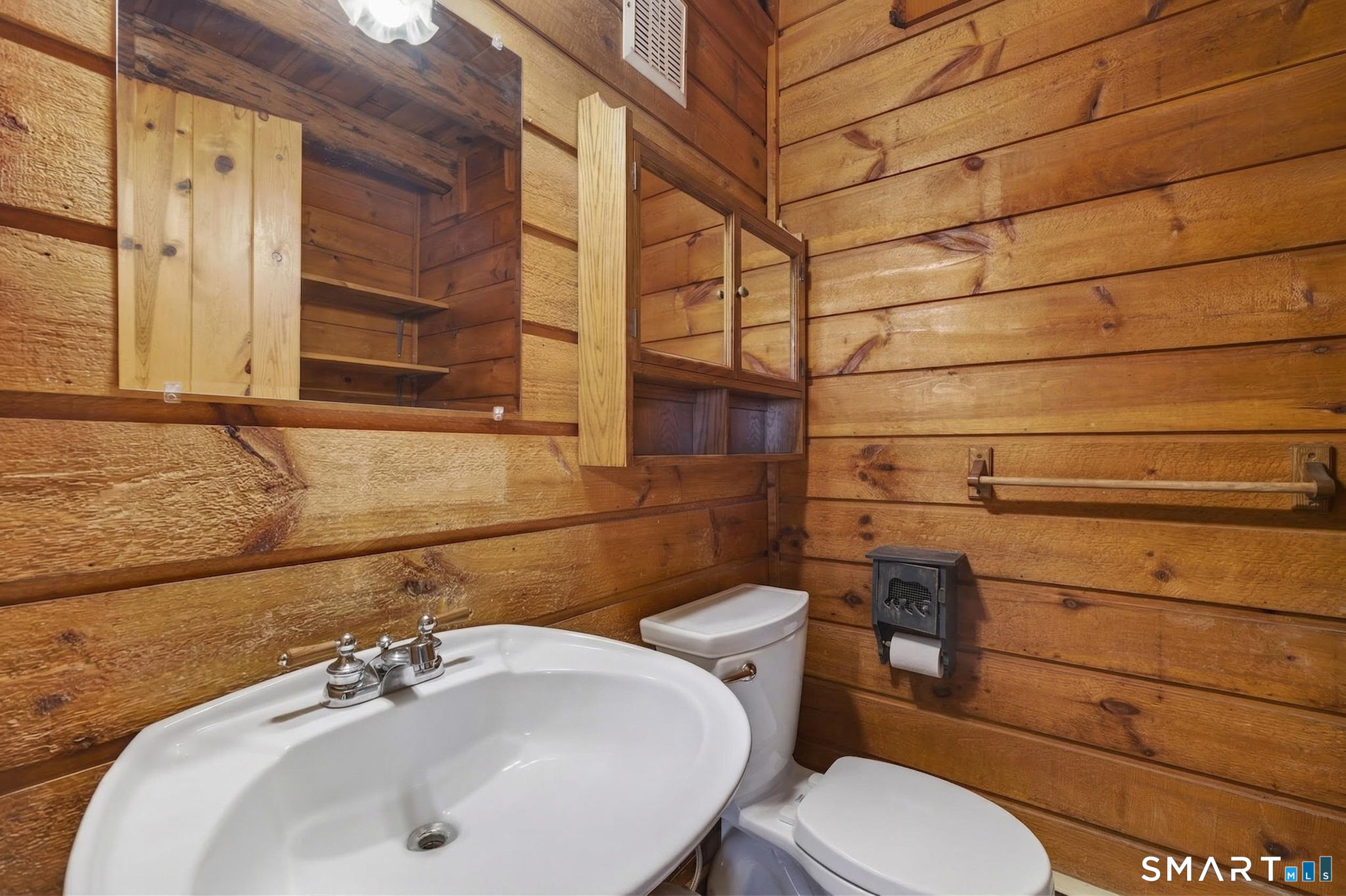 737 Shepard Avenue Hamden, CT 06514 - Photo 25 of 33 a bathroom with a sink toilet and mirror