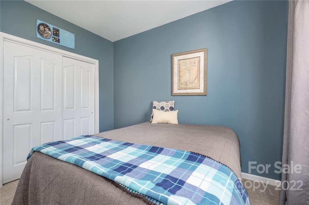 8010 Trotter Road Charlotte, NC 28216 - Photo 13 of 42 a bedroom with a bed and a window