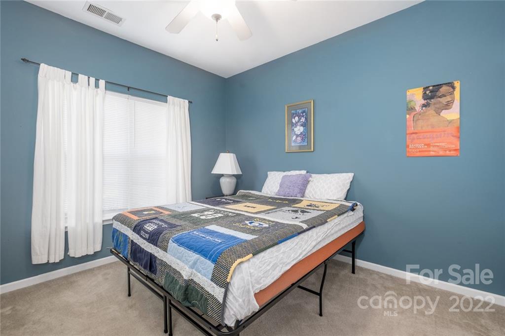 8010 Trotter Road Charlotte, NC 28216 - Photo 14 of 42 a bedroom with a bed and a window