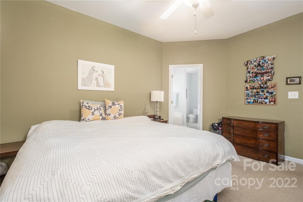 8010 Trotter Road Charlotte, NC 28216 - Photo 18 of 42 a bedroom with a bed and a dresser