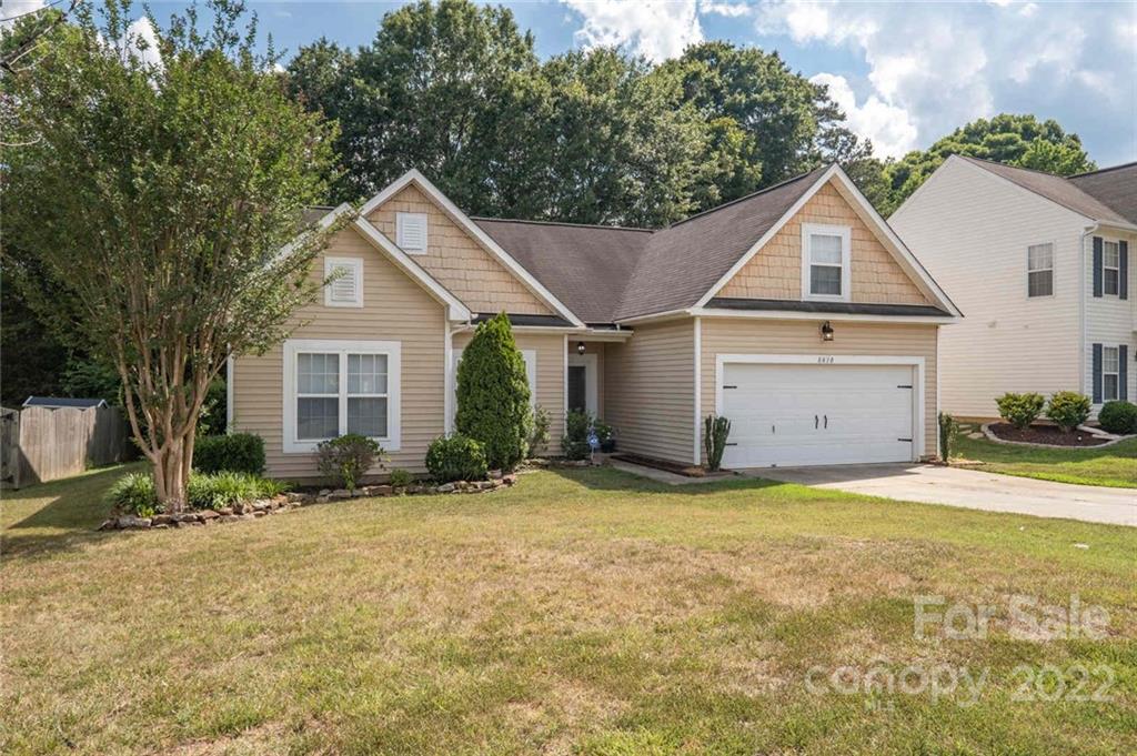 8010 Trotter Road Charlotte, NC 28216 - Photo 2 of 42 a view of a house with yard and large tree