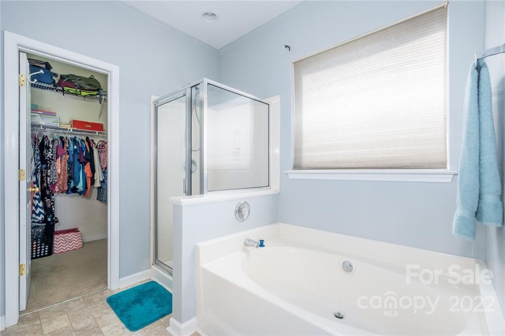 8010 Trotter Road Charlotte, NC 28216 - Photo 21 of 42 a white bath tub sitting next to a bathroom