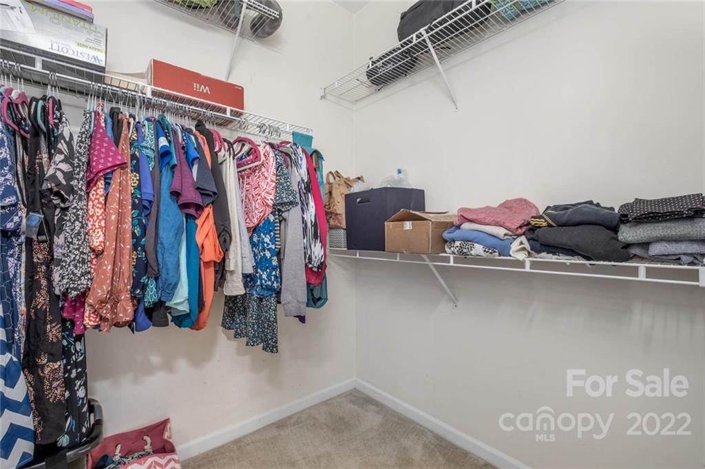 8010 Trotter Road Charlotte, NC 28216 - Photo 22 of 42 a view of walk in closet with clothes