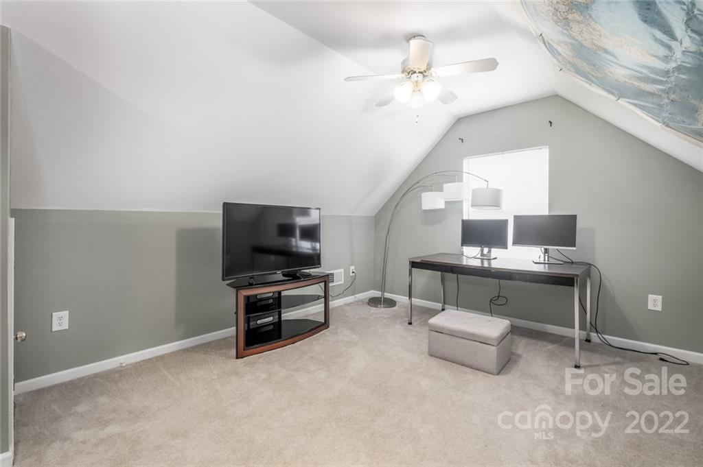 8010 Trotter Road Charlotte, NC 28216 - Photo 25 of 42 a living room with furniture and a flat screen tv