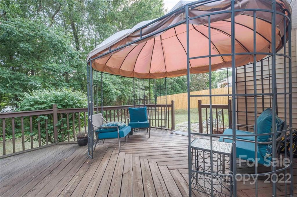 8010 Trotter Road Charlotte, NC 28216 - Photo 26 of 42 a view of a balcony with furniture and wooden floor