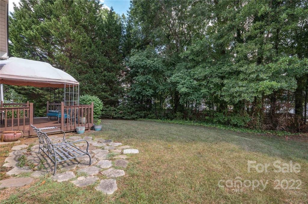 8010 Trotter Road Charlotte, NC 28216 - Photo 28 of 42 a view of a backyard with chairs and a small yard