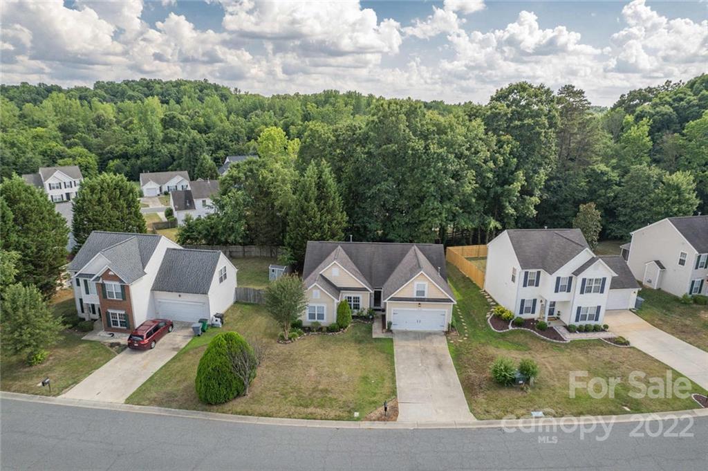 8010 Trotter Road Charlotte, NC 28216 - Photo 32 of 42 an aerial view of a house with swimming pool and garden