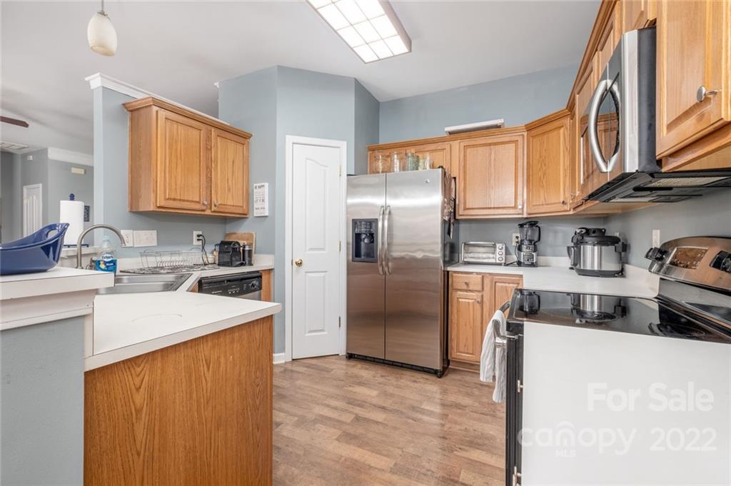 8010 Trotter Road Charlotte, NC 28216 - Photo 9 of 42 a kitchen with stainless steel appliances granite countertop a refrigerator and a sink