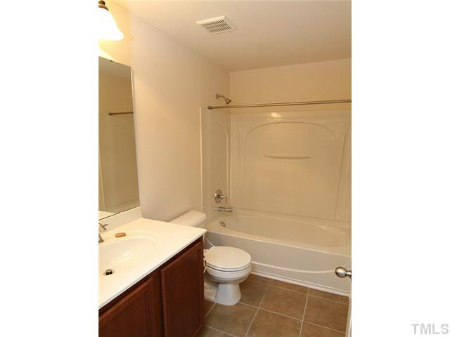 6501 Ridgemount Street Wake Forest, NC 27587 - Photo 20 of 25 Hall Bathroom has tile floors and a tub/shower combination.