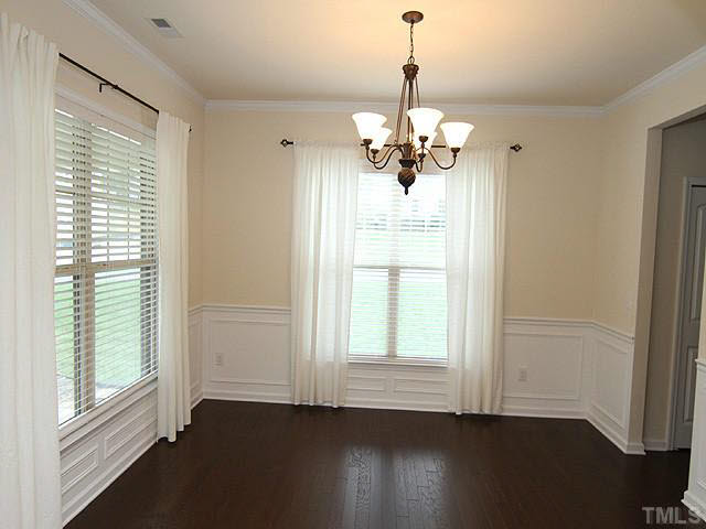 6501 Ridgemount Street Wake Forest, NC 27587 - Photo 5 of 25 Your formal dining room has some great looking moldings! Those 2" blinds are throughout your home.