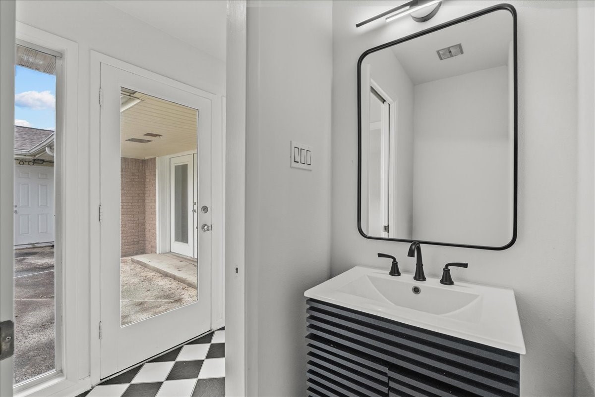 5762 Birdwood Road Houston, TX 77096 - Photo 37 of 50 LUXURY POWDER BATH IN THE HALLWAY OFF PATIO AND KITCHEN.