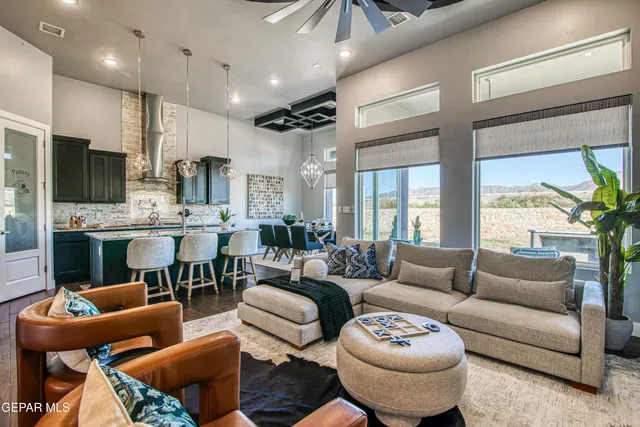 a view of a hallway with wooden floor and a bathroom