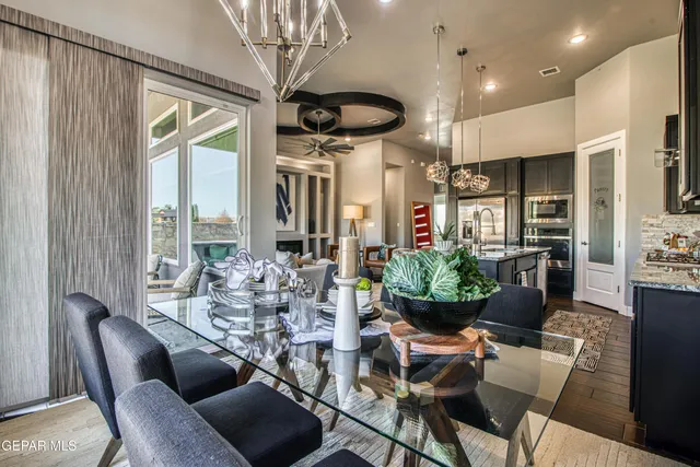 a bathroom with a tub a mirror and shower
