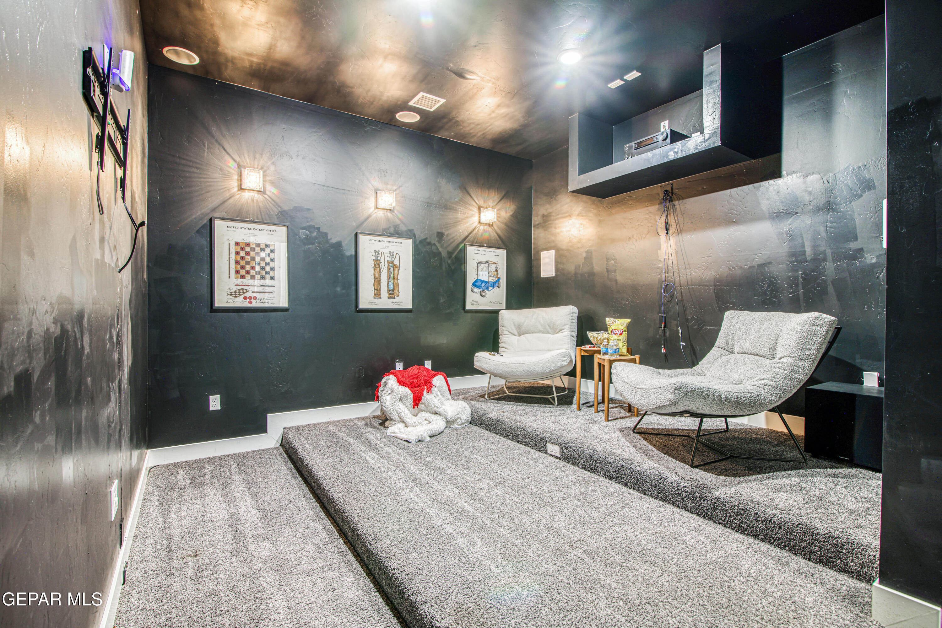 6716 Rio Haciendas El Paso, TX 79932 - Photo 26 of 65 a living room with furniture and chandelier