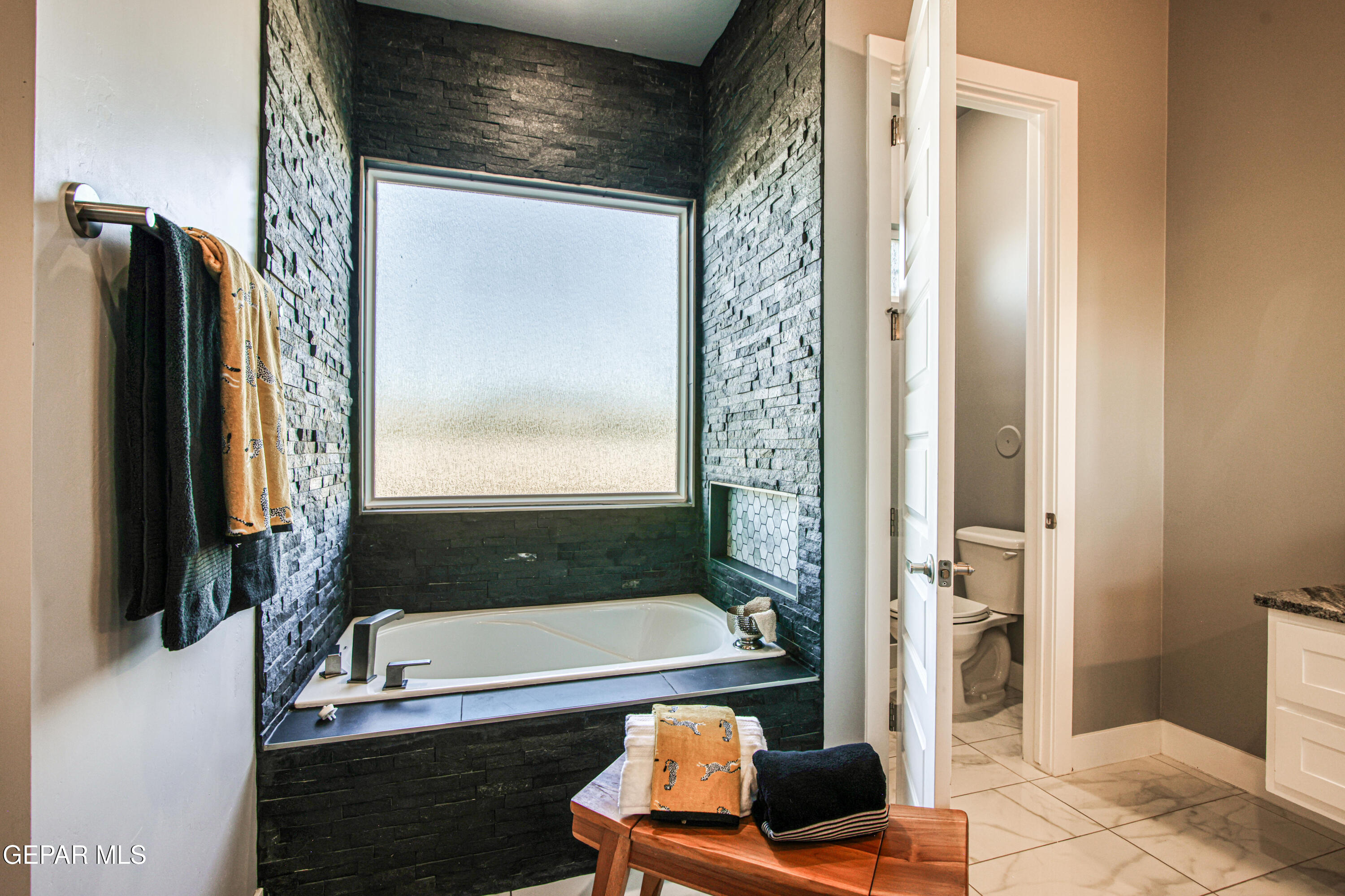 6716 Rio Haciendas El Paso, TX 79932 - Photo 40 of 65 a bathroom with a tub and a shower
