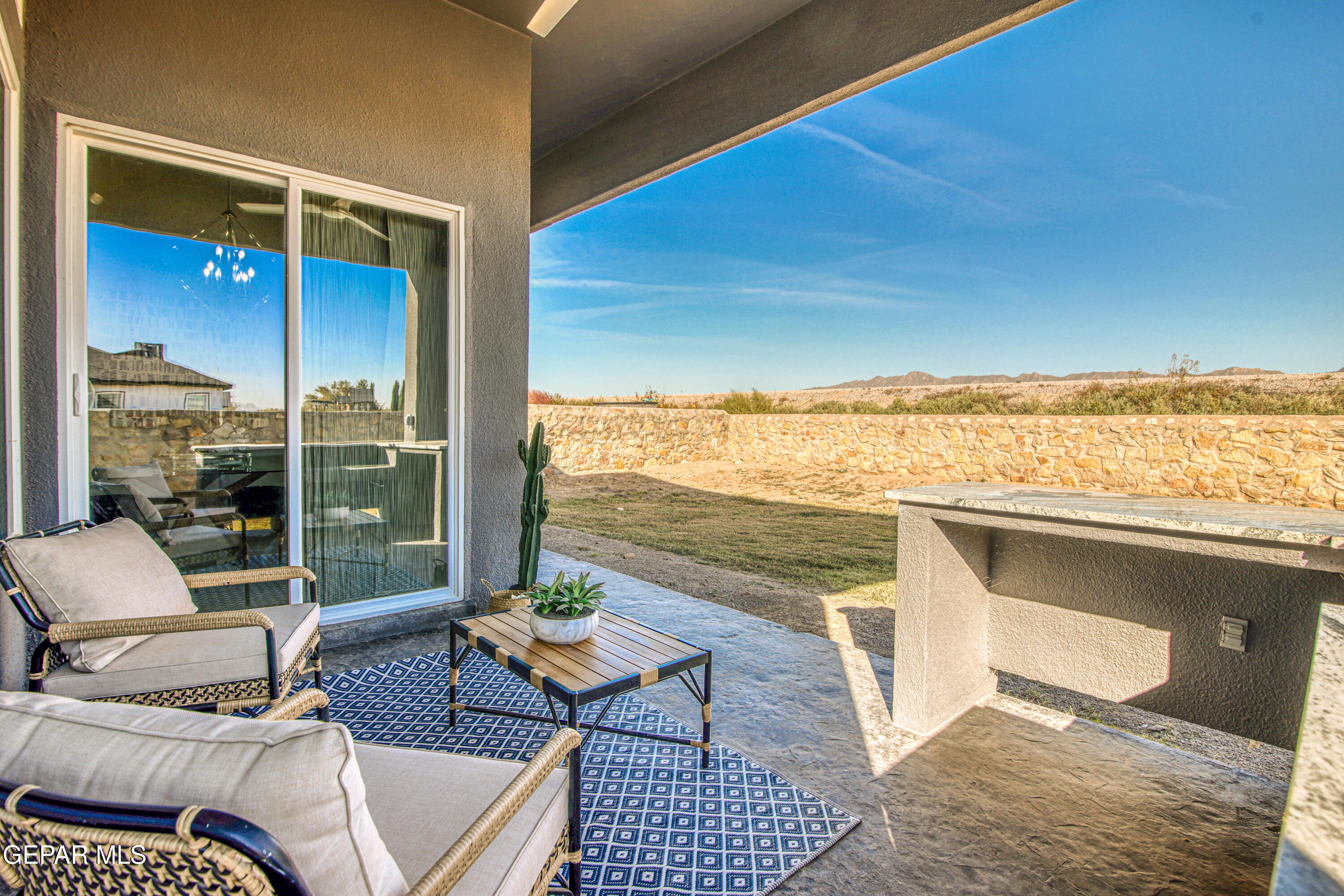6716 Rio Haciendas El Paso, TX 79932 - Photo 61 of 65 a balcony with furniture and city view
