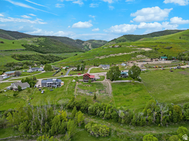 306 Spring Road Preston, ID 83263 - Photo 34 of 55 Expansive green hills surround a community of homes with paved roads