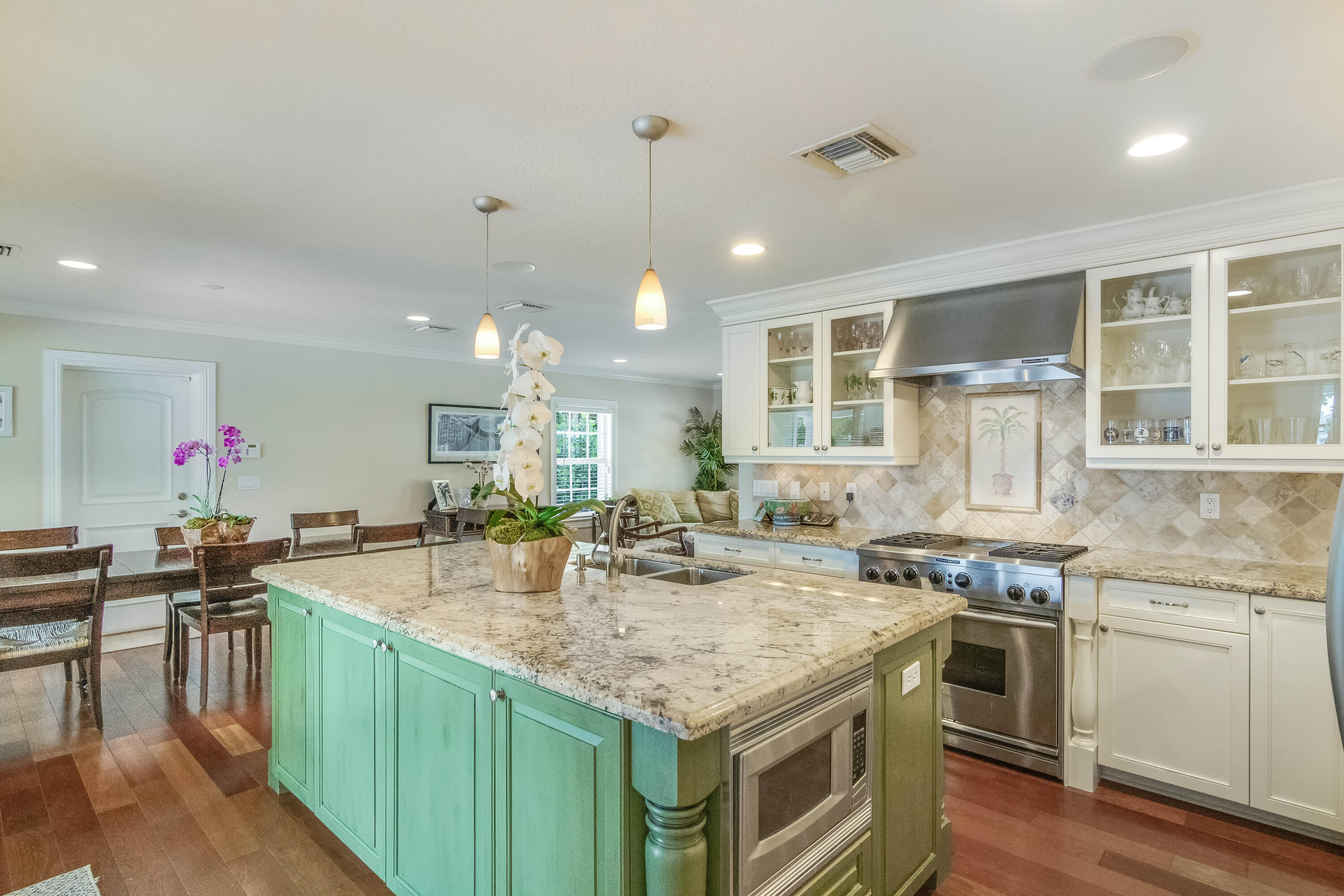 936 Dolphin Drive Jupiter, FL 33458 - Photo 13 of 72 a kitchen with granite countertop a stove and cabinets