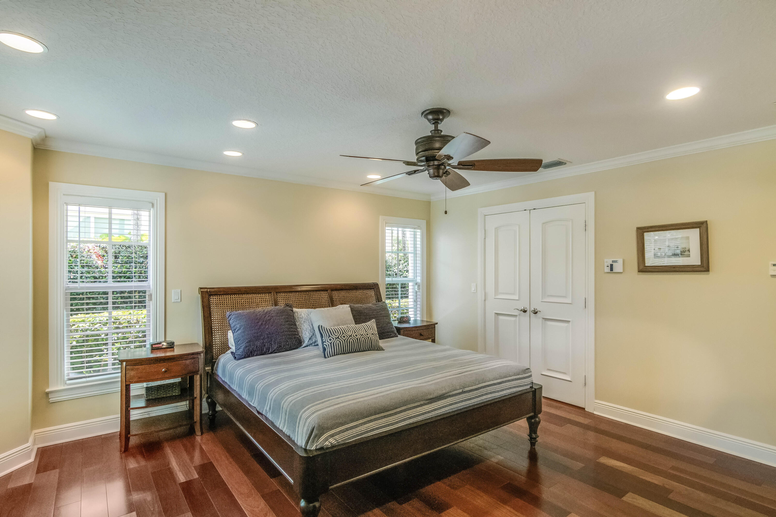 936 Dolphin Drive Jupiter, FL 33458 - Photo 16 of 72 a bedroom with a bed and wooden floor