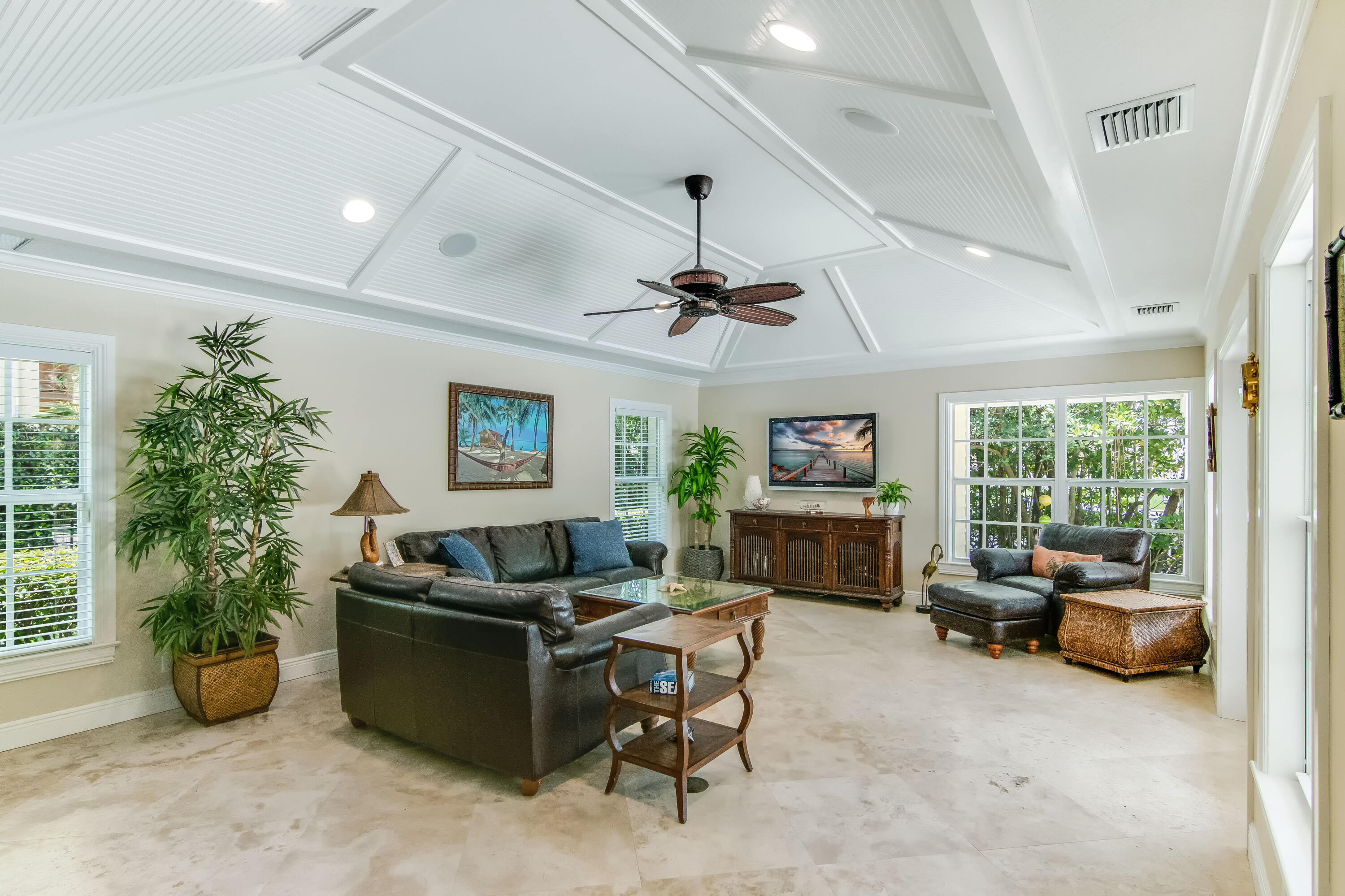 936 Dolphin Drive Jupiter, FL 33458 - Photo 23 of 72 a living room with furniture and a fireplace